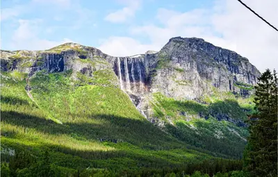 a mountain with trees in front of it at Stunning Apartment In Hemsedal in Hemsedal