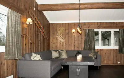 a living room with a couch and a table at Stunning Apartment In Hemsedal in Hemsedal
