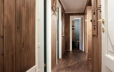 a hallway with wood paneled walls and a hallway with a hallway at Stunning Apartment In Hemsedal in Hemsedal