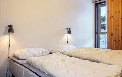 two beds sitting next to each other in a bedroom at Cozy Apartment In Hemsedal With Sauna in Hemsedal
