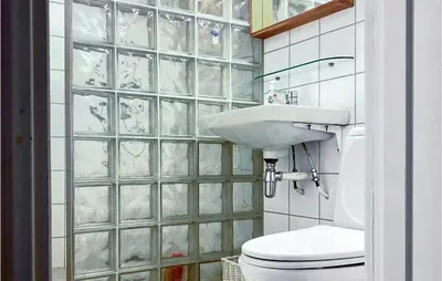 a bathroom with a toilet and a sink at 4 Bedroom Lovely Home In Ål in Ål