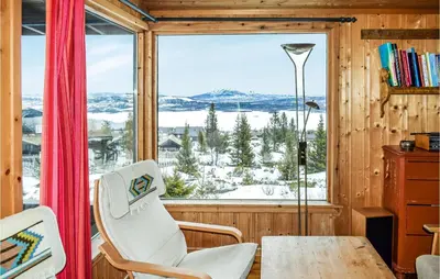 a room with a large window and a table and chairs at 2 Bedroom Beautiful Home In Gol in Gol