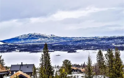 a snow covered mountain with a town and a lake at 2 Bedroom Beautiful Home In Gol in Gol