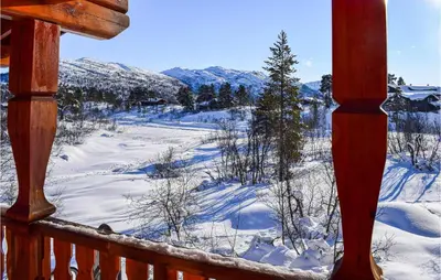 a winter view from a porch with snow on the ground at Cozy Home In Hovden I Setesdal in Hovden