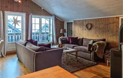 a living room with two couches and a table at Beautiful Home In Hovden I Setesdal in Hovden