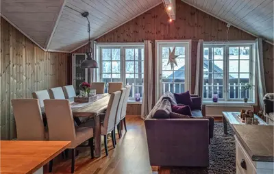 a dining room with a table and chairs at Beautiful Home In Hovden I Setesdal in Hovden