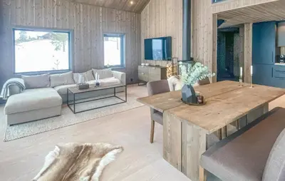 a living room with a couch and a table at Awesome Home In Hønefoss With Wifi in Hønefoss