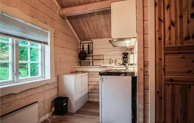 a kitchen in a tiny house at Stunning Home In Frosta