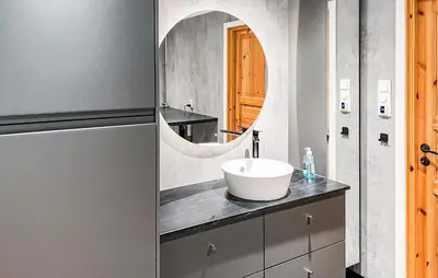 a bathroom with a sink and a mirror at Nice Home In Malm With Lake View in Malm