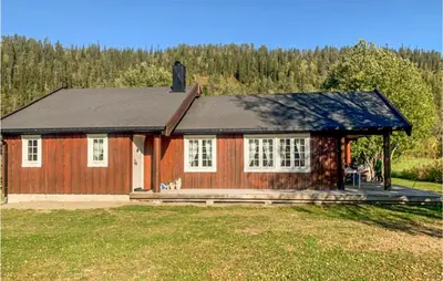 a small red house with a gambrel roof at Nice Home In Beitstad With Kitchen in Sunnan