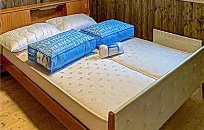 three mattresses sitting on top of a bed at Nice Home In Beitstad With Kitchen in Sunnan