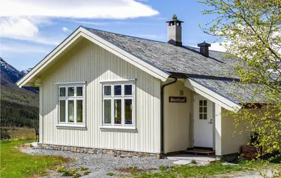 a small white building with a door and windows at Nice Home In Hemsedal With Sauna in Hemsedal