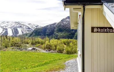 a sign on the side of a building with a mountain at Nice Home In Hemsedal With Sauna in Hemsedal