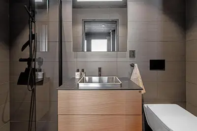 a bathroom with a sink and a shower at Kikut Alpine Lodge 9103 in Geilo