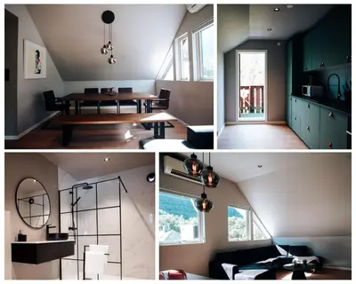 a living room with a table and a dining room at Trolltunga Panorama in Tysso