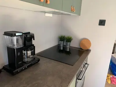 a kitchen with a coffee maker on a counter at Trolltunga Panorama in Tysso