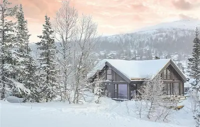 a cabin in the snow with snow covered trees at 4 Bedroom Beautiful Home In Rjukan in Rjukan