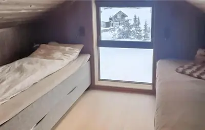 a small room with two beds and a window at 4 Bedroom Beautiful Home In Rjukan in Rjukan