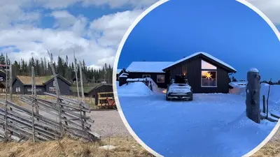 a mirror reflection of a car in front of a cabin at Koselig hytte - Trysilfjellet ski in og ski out 4 soverom, 2 bad, badstue, fiber bredbånd og Elbillader in Trysil