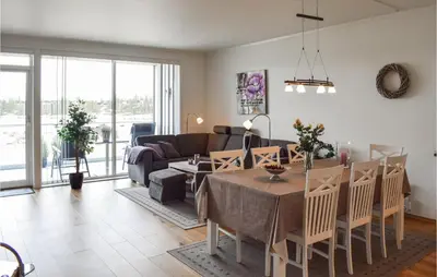 a living room with a table and a couch at Fjellheimen Nr 104 in Sjusjøen