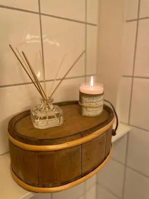 a candle and a container on top of a wooden barrel at Hytte i nydelige Jotunhemen - rett ved Besseggen in Randsverk