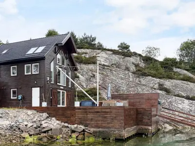 a house on the shore of a body of water at 6 person holiday home in Urangsvåg-By Traum in Ervik