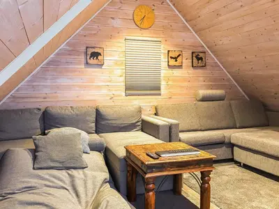a living room with a couch and a table at 6 person holiday home in Urangsvåg-By Traum in Ervik