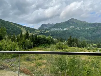 a view of the mountains from a window at Snøya Lodge in Hemsedal