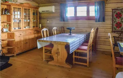 a dining room with a table and chairs at Bergheim in Vikersund