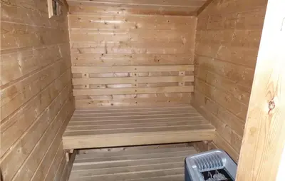 a wooden sauna with a bench in it at Solbakken in Vikersund