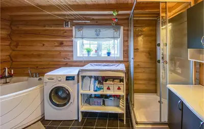 a laundry room with a washing machine and a sink at Nice Home In Vinstra With Kitchen in Vinstra