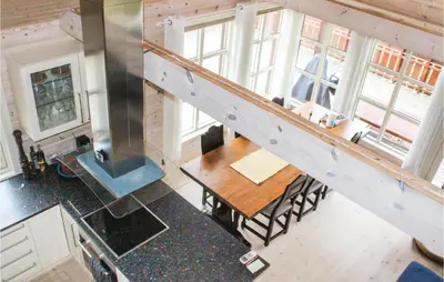 an overhead view of a kitchen and dining room with a staircase at 4 Bedroom Nice Home In Sogndal in Sogndal