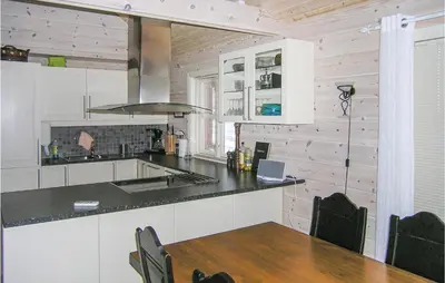 a kitchen with a table and a counter top at 4 Bedroom Nice Home In Sogndal in Sogndal