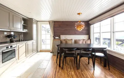 a kitchen with a dining room table and chairs at Mosetertoppen Panorama, Anneks 2B - Hafjell in Hafjell
