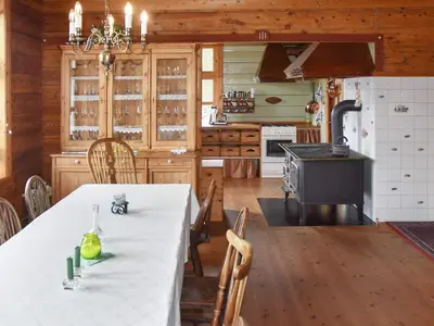 a kitchen with a table and a stove at 8 person holiday home in Ørskog-By Traum in Ørskog