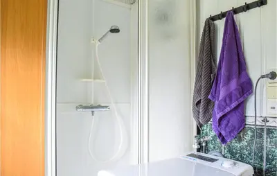 a bathroom with a shower and a sink at 6 Bedroom Beautiful Home In Vossestrand in Vossestrand