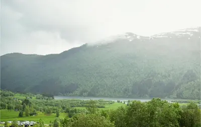 a view of a mountain with a lake and trees at 6 Bedroom Beautiful Home In Vossestrand in Vossestrand