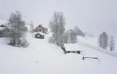 a snow covered village with houses and trees at 6 Bedroom Beautiful Home In Vossestrand in Vossestrand