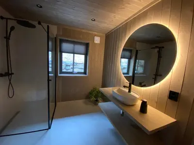 a bathroom with a sink and a mirror at Høgerinden Lodge in Sogndal