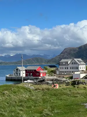 a group of buildings next to a body of water at Torvholmen in Fosnavåg