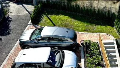 a couple of cars parked in a parking lot at Ibsens in Bergen