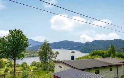 a view of a lake from a house at Gorgeous Home In Øydegard in Nastad
