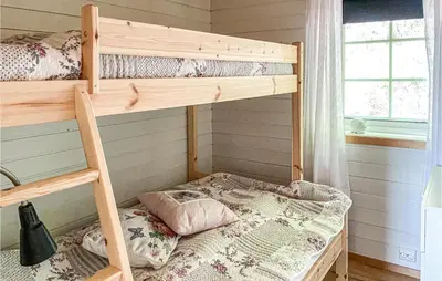 a bedroom with two bunk beds in a room at Gorgeous Home In Øydegard in Nastad