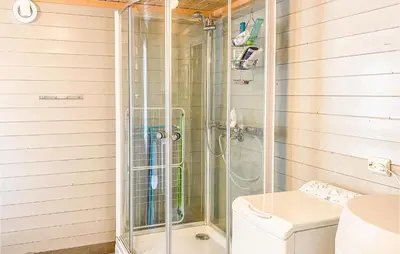 a shower with a glass door in a bathroom at Gorgeous Home In Øydegard in Nastad