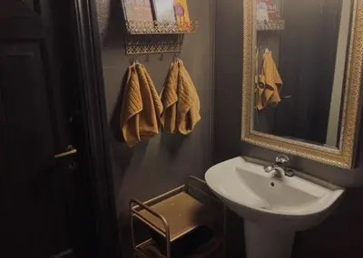 a bathroom with a sink and a mirror at Steinsvoll Gård in Vang I Valdres