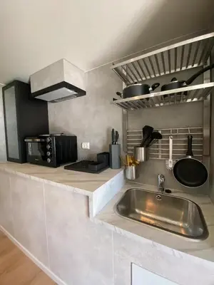a kitchen with a sink and a counter top at Vikavegen Stryn in Stryn