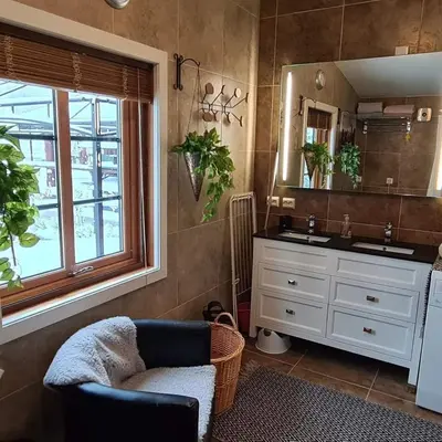 a bathroom with a sink and a mirror at DaVita Ranch in Tranhaug
