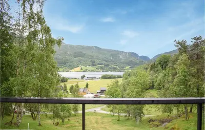 a view from a balcony of a river and mountains at 3 Bedroom Stunning Home In Vossestrand in Vossestrand