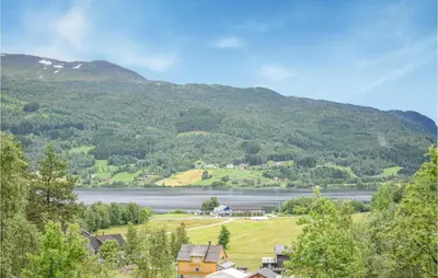 a view of a town and a lake and mountains at 3 Bedroom Stunning Home In Vossestrand in Vossestrand