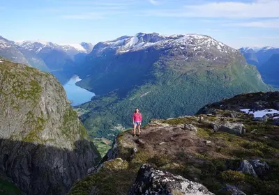 a person standing on top of a mountain at Nesje Gardstun in Oppstryn